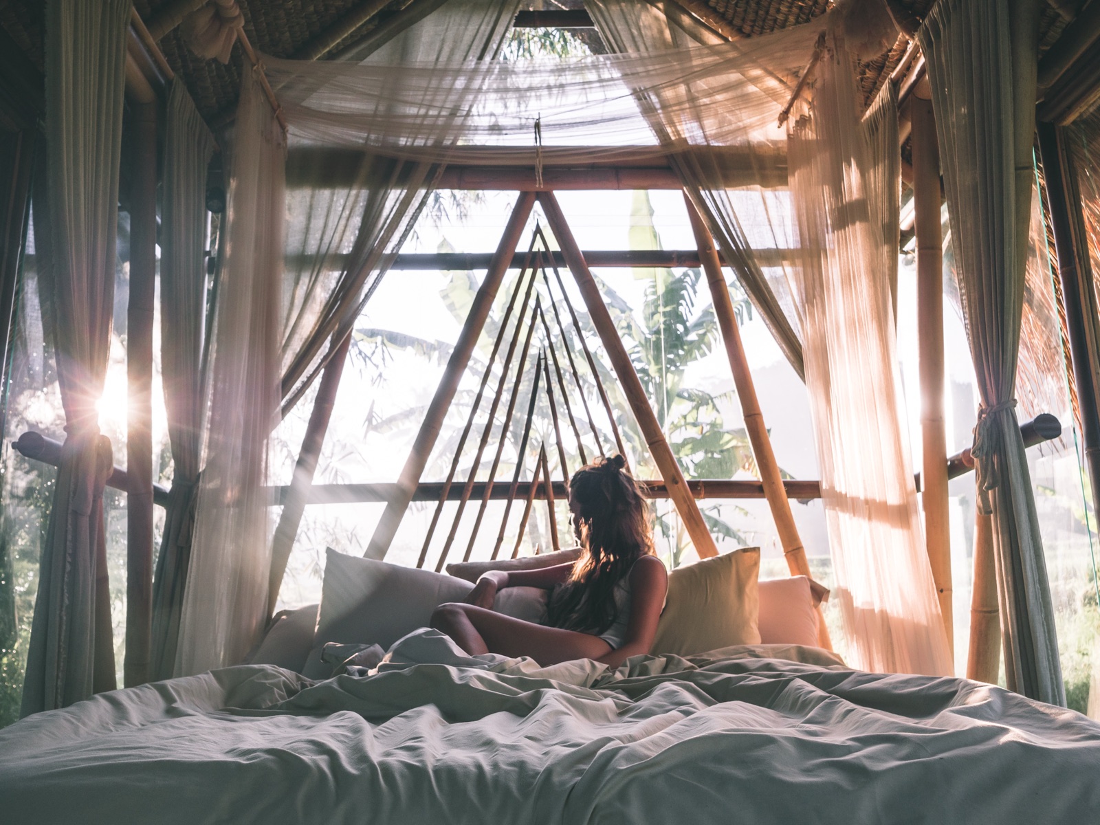 Sunrise inside a bamboo bedroom at hideout bali, East Bali